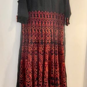 Black lace georgette ANARKALI with red and orange embroidery on it.